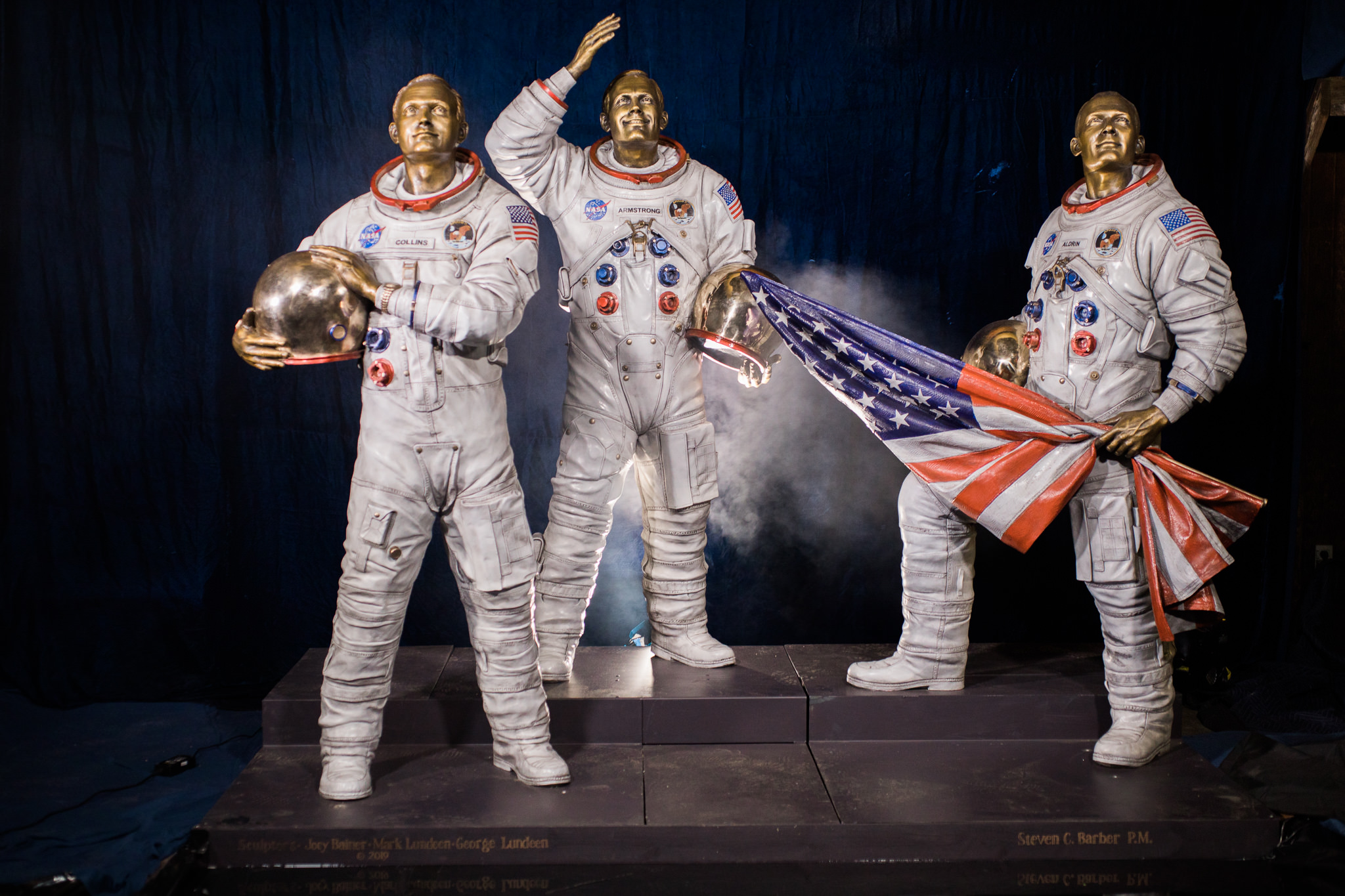The Eagle Has Landed bronze monument depicting Apollo 11 astronauts Michael Collins, Neil Armstrong, and Buzz Aldrin with an American flag