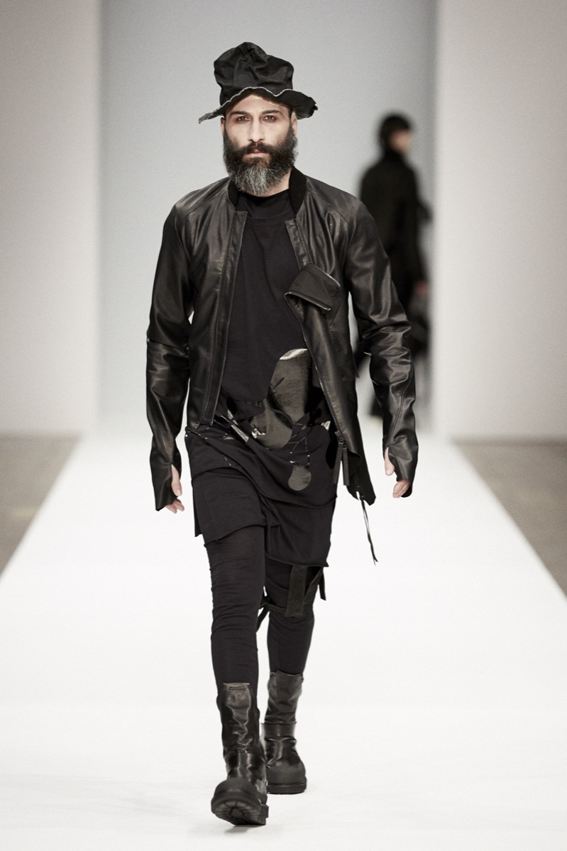 Male runway model in black leather at a menswear show